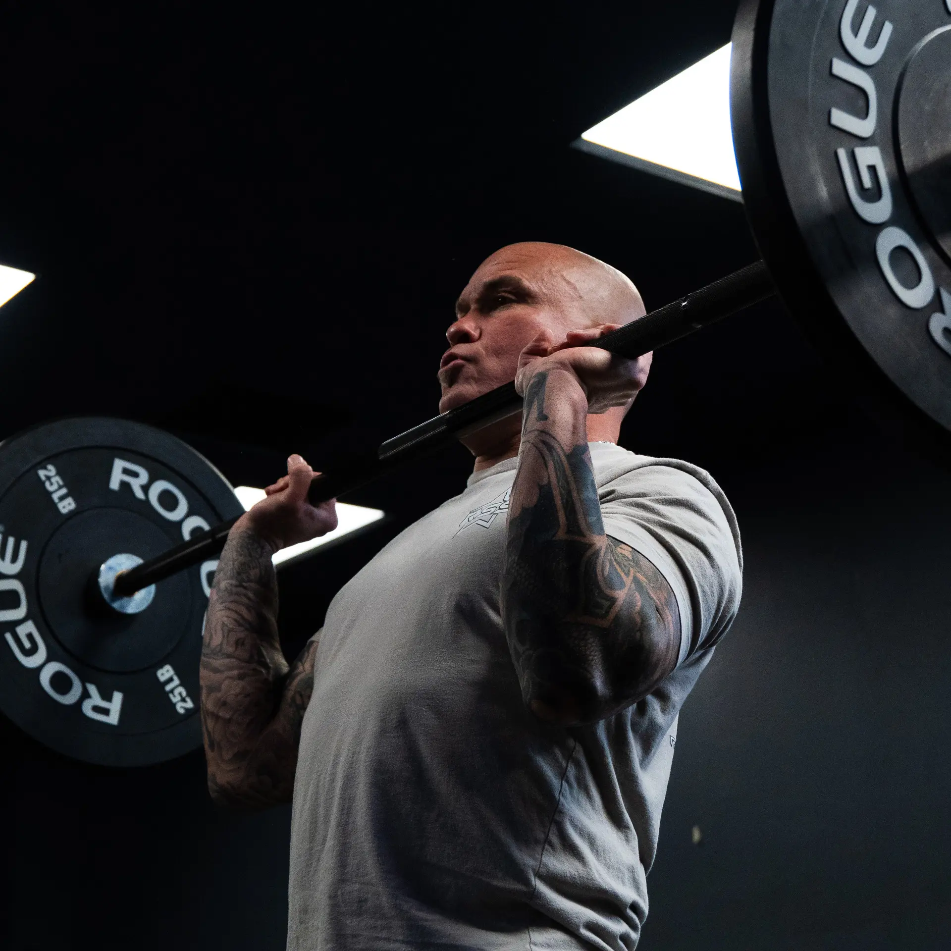 Male weight training in gym